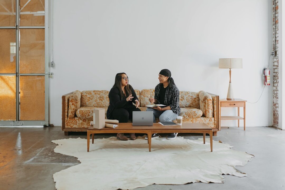 two people talking on couch